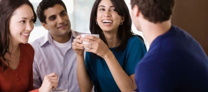 Spanish lessons in NYC. Friends talking in cafe in New York, NY, speaking Spanish