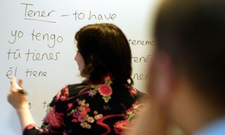 a woman teaching spanish to students in Brooklyn