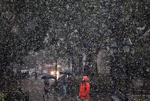 A man standing in the snow in New York City