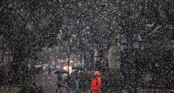 A man standing in the snow in New York City